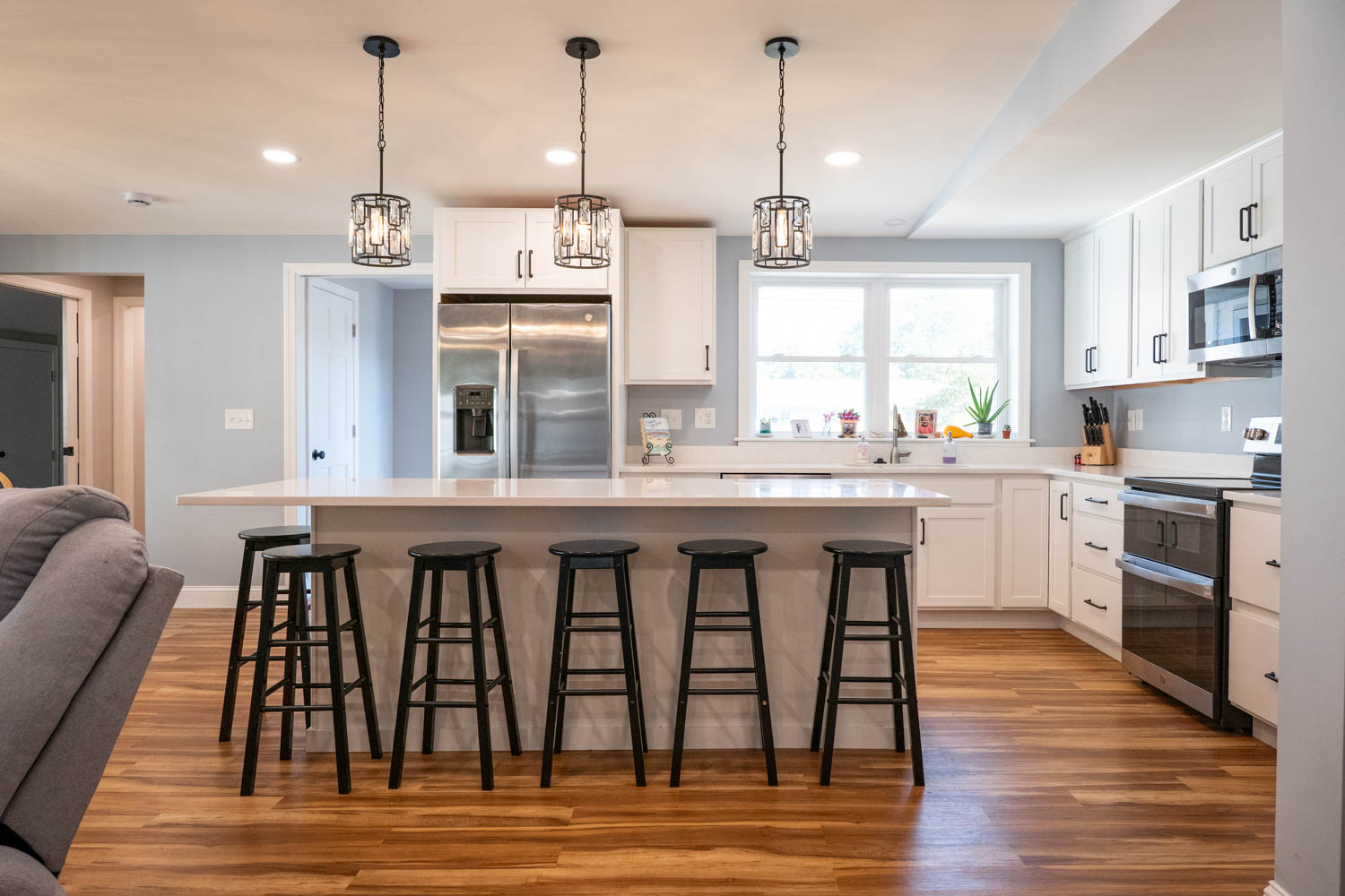 Completed Beverly kitchen renovation with white cabinets and large island
