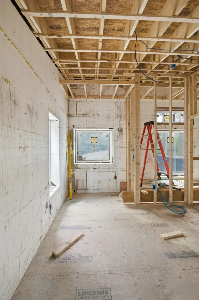 Construction manager discussing project scope inclusions and financial accuracy with client