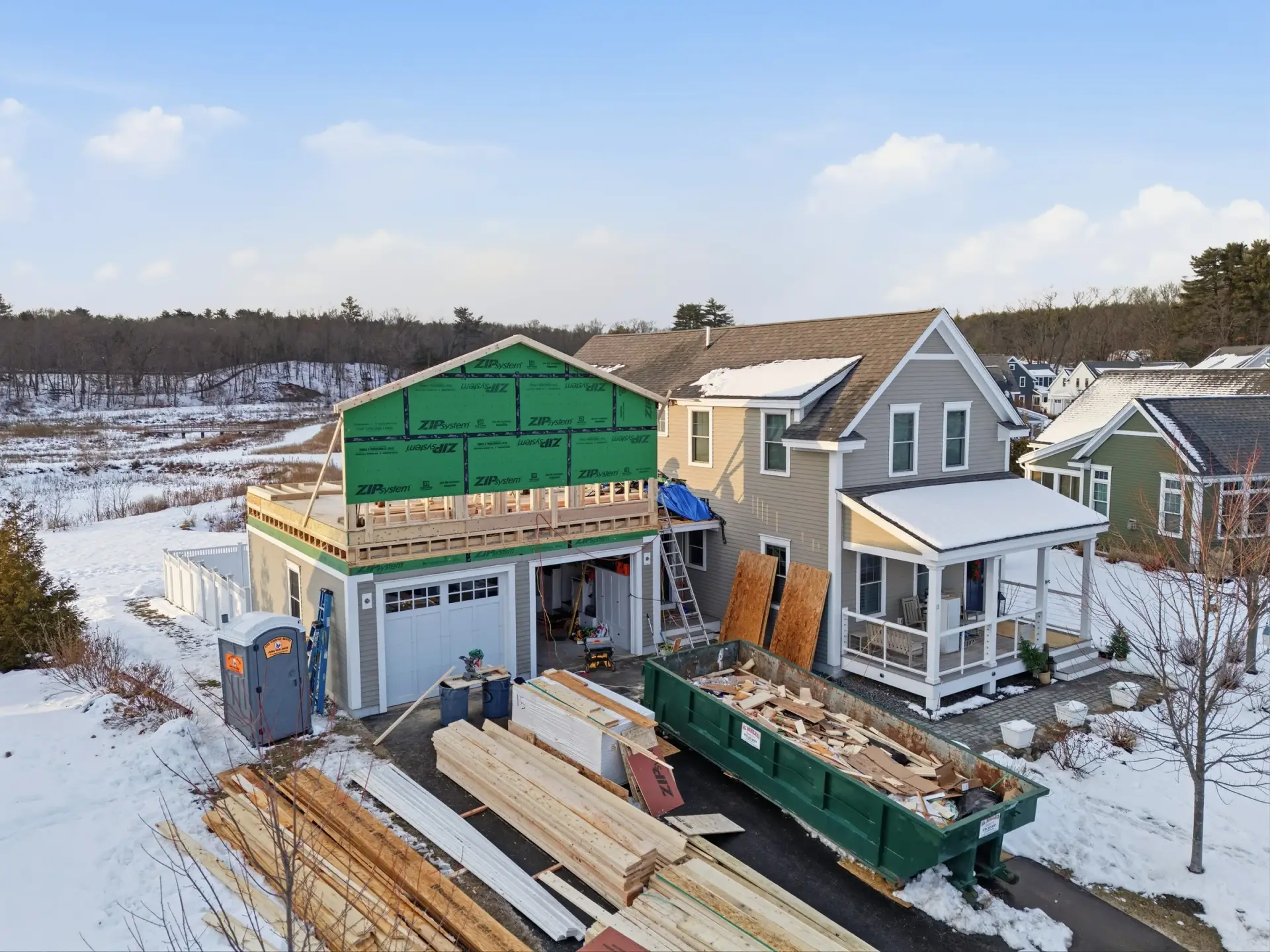 Above-garage addition during framing with green wall sheathing