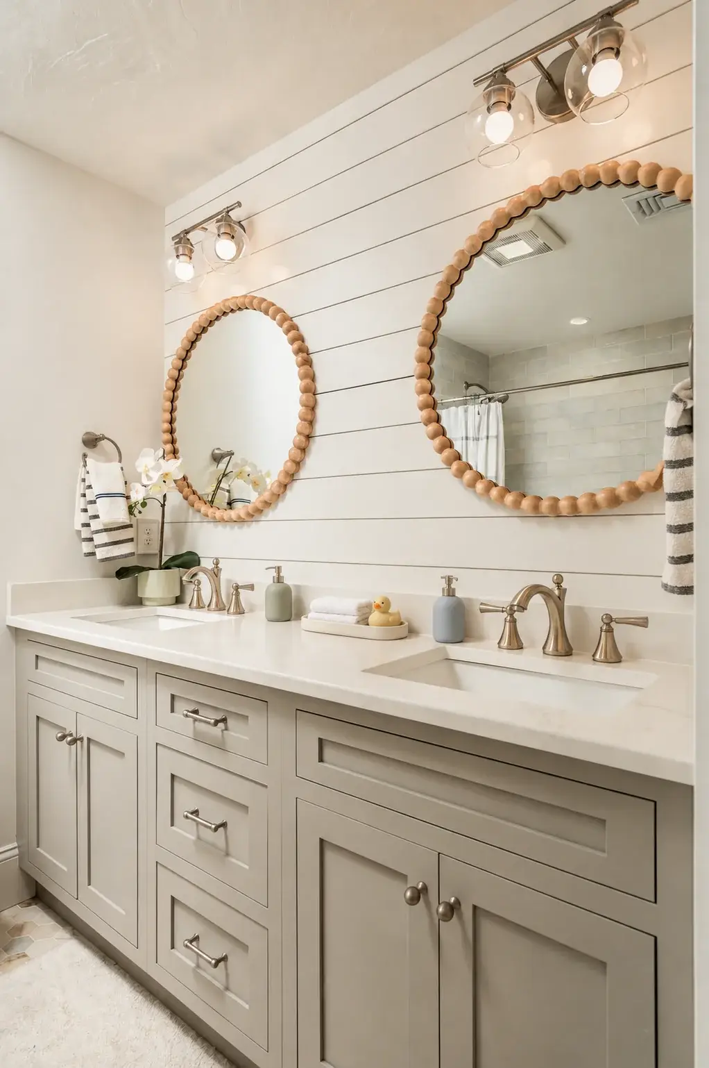Children's double vanity with round wood mirrors and shiplap walls