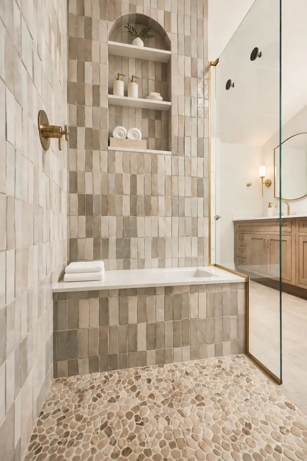 Tiled shower with arched niche and bench